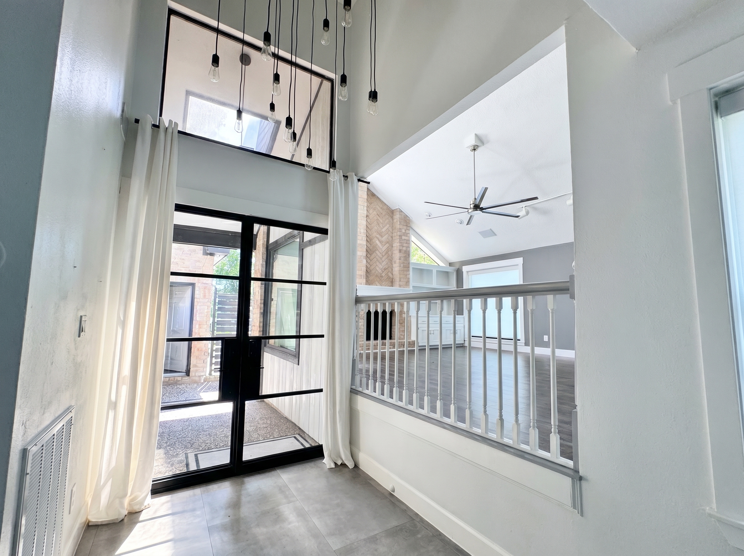 Foyer opens to living and dining