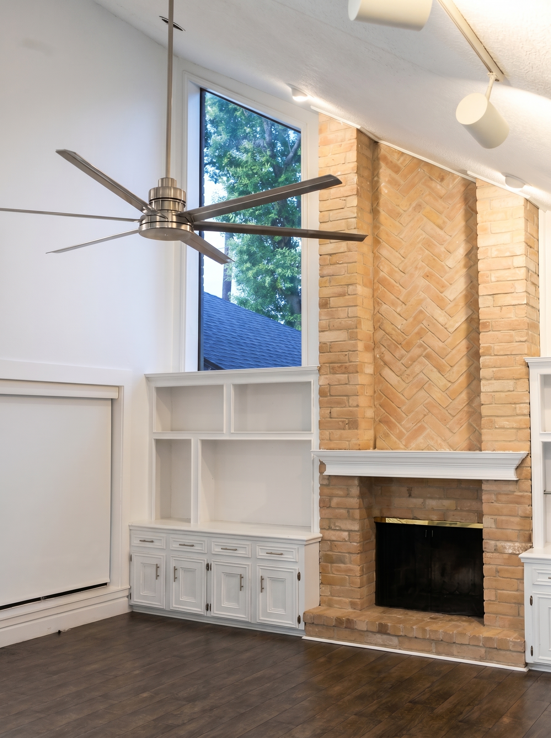 Gas fireplace flanked by built-ins
