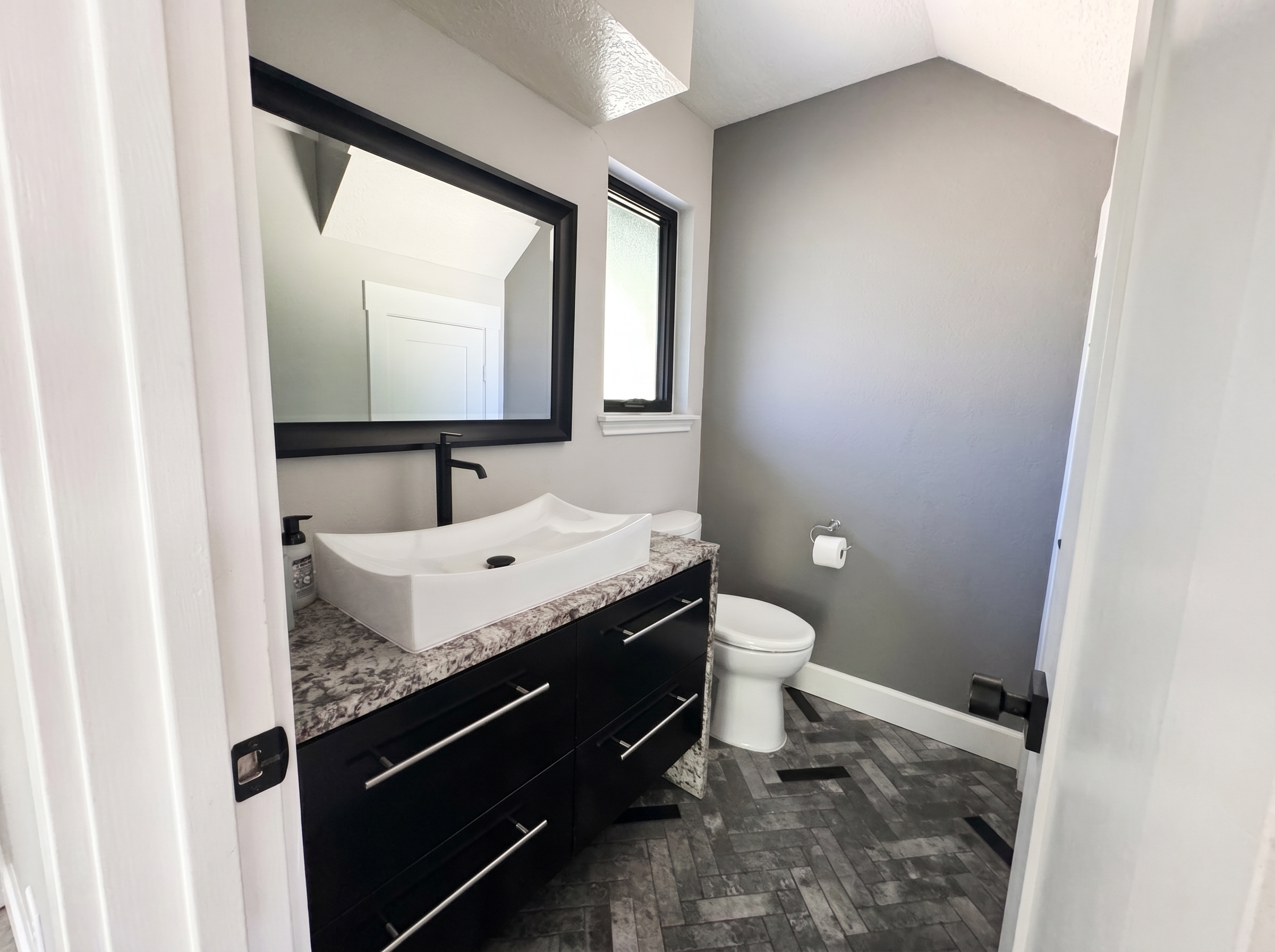 Powder bath tucked under the stairs