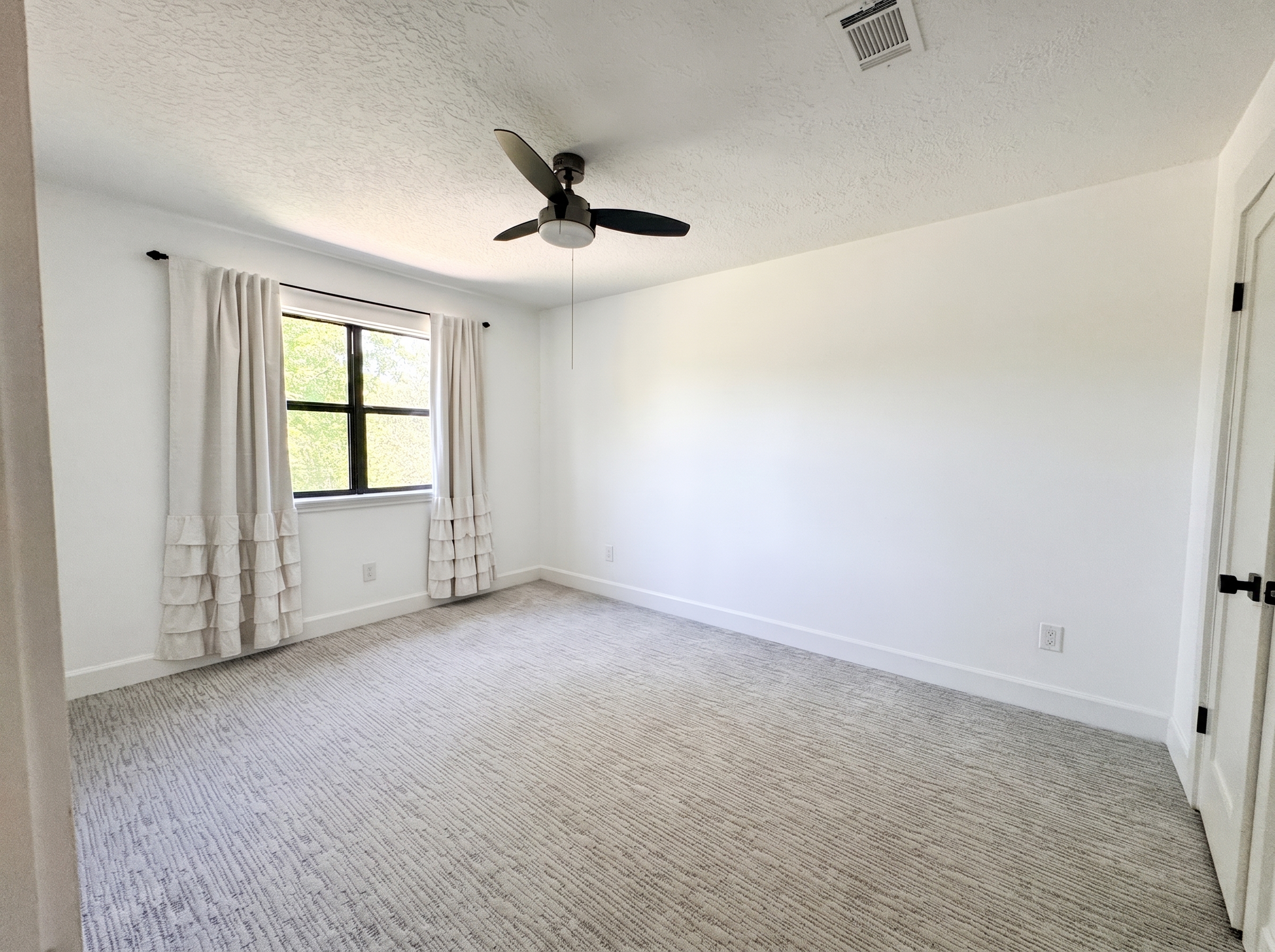 One of three upstairs bedrooms